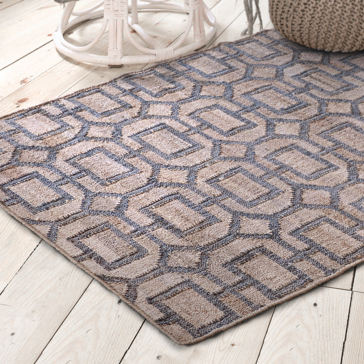 Lifestyle photo. Jute rug shown against a whitewashed wood floor.