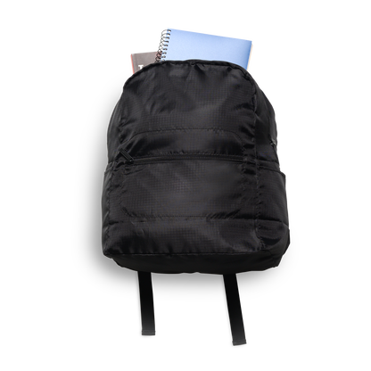 Photo showing the backpack with school supplies poling out the top.