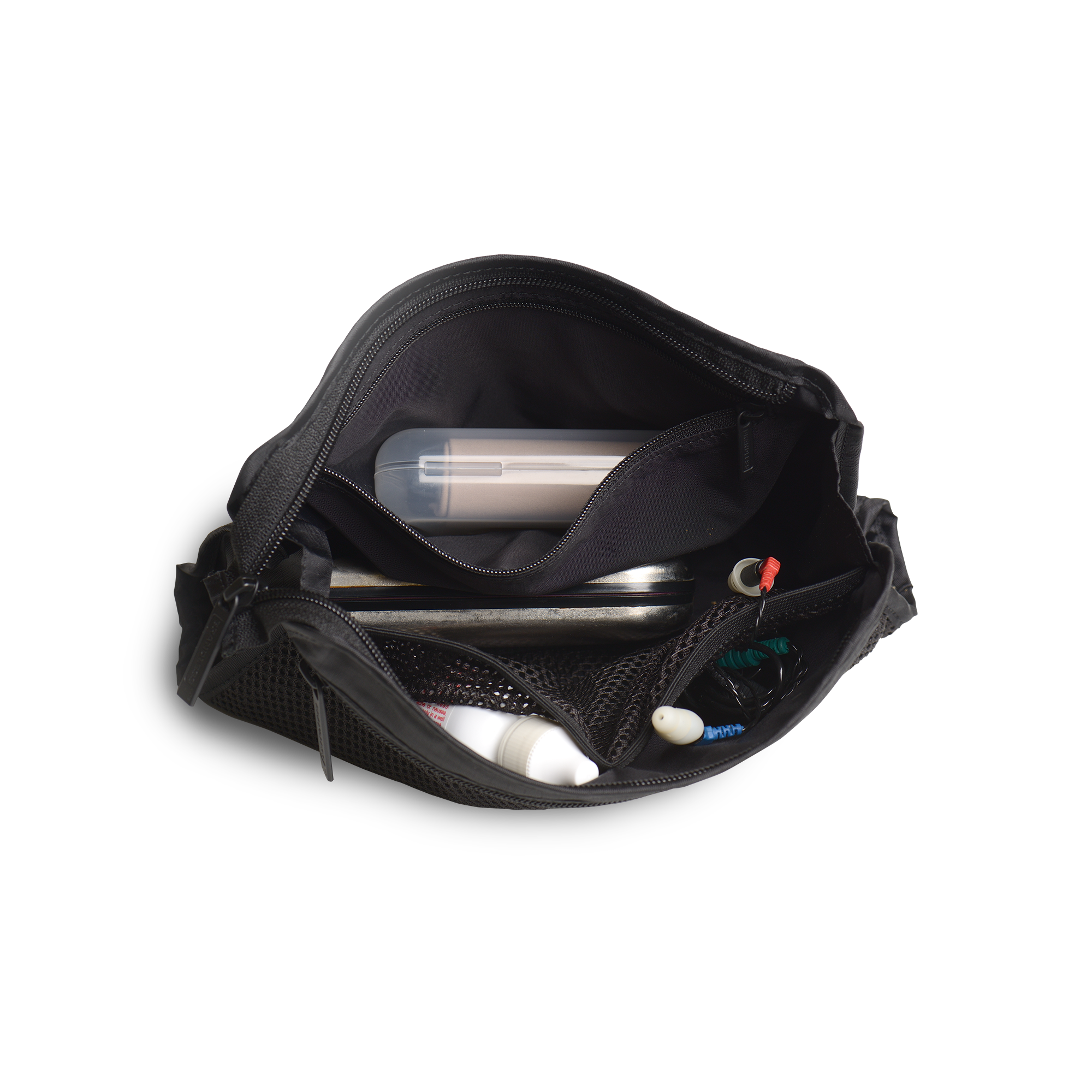 Lifestyle.  Top down view of a loaded travel organizer unzipped and splayed open to show the case holding and organizing glasses cases, eye drops, ear plugs, headphones, and misc easily in separate internal compartments.