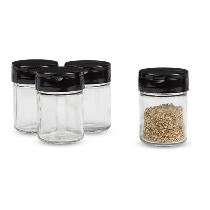 4 glass spice jars with black plastic flip and pour lids. 1 jar has spices in it.