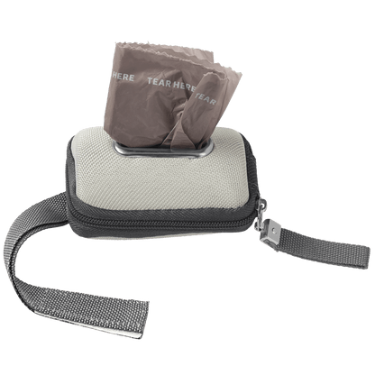 Front view, pet wastebag dispenser with zipper, velcro strap, and displensing opening showing dog waste bags ready to pull out.