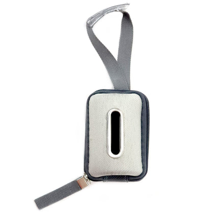 Top view, waste bag dispenser, empty, showing metal-rimmed dispensing slot.