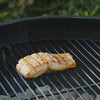 Video, no sound.  Grill spatula used to slide effortlessly underneath delicate foods like this fish fillet. Grill spatula. Stainless steel. Large perforated blade. Non-slip nylon handle. Serrated edge for cutting. Brandless. Designed for outdoor grills.