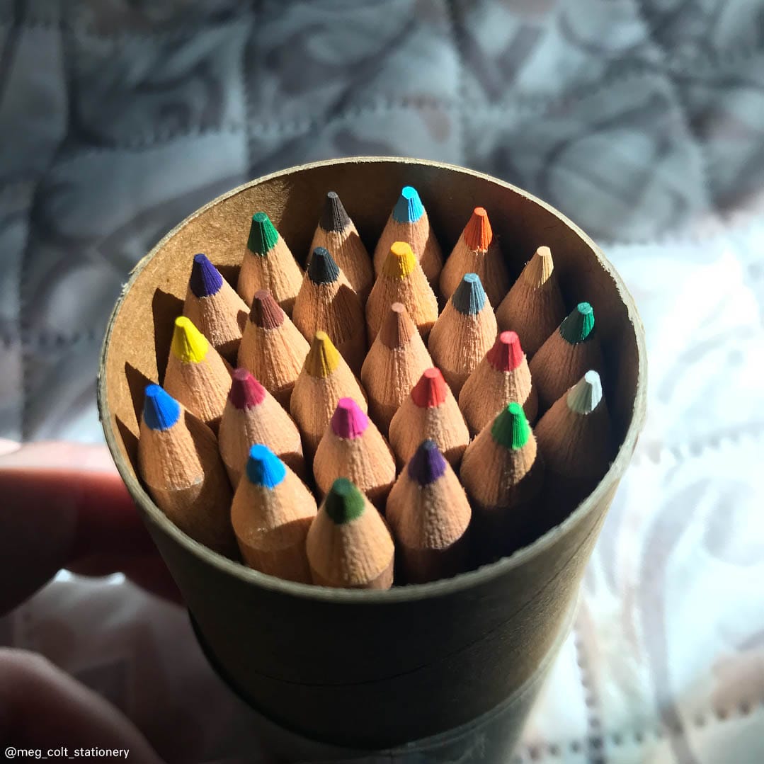 Lifestyle photo, top view, looking down at the pre-sharpeneed tips of the colored pencils.